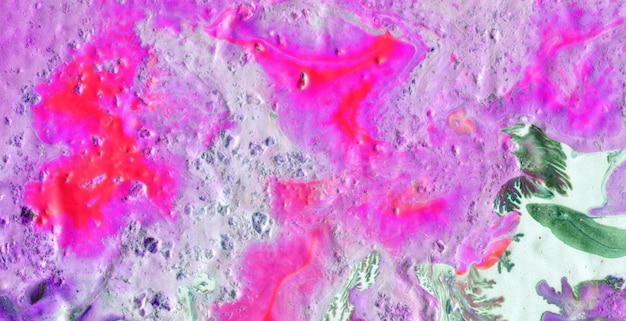 A close up of the moon surface with pink and purple colors.