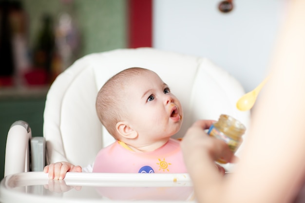 Close up of a mother feeding her baby