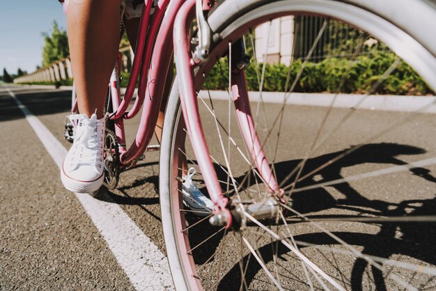 Close Up. Mulatto Girls Leg On The Bike Pedal in Road.