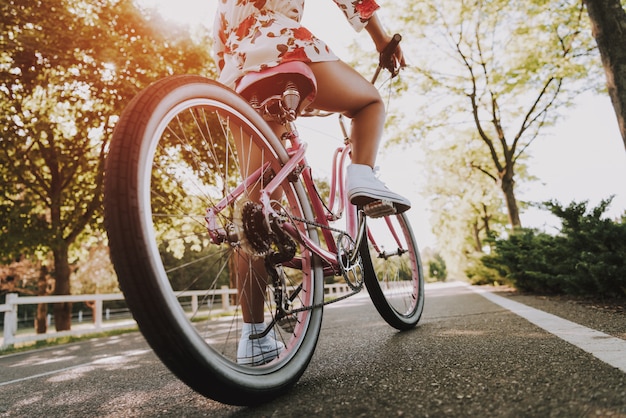 Close Up. Mulatto Girls Leg On The Bike Pedal.