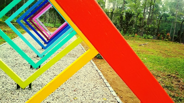 Photo close-up of multi colored umbrella on grass