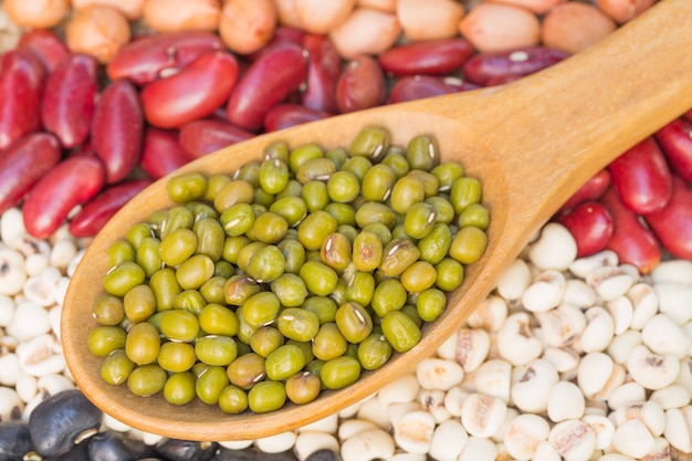 Close up of mung bean and wooden spoon