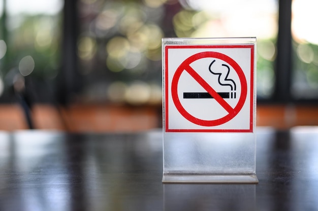 Close-up of no smoking sign on table in restaurant