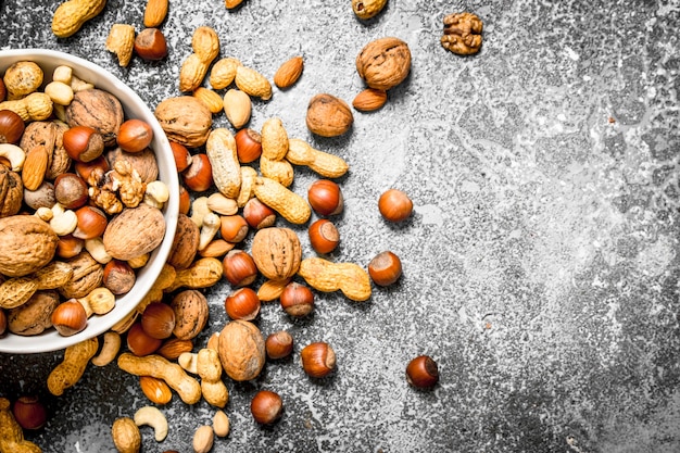 Close up on nuts in bowl with nutcracker