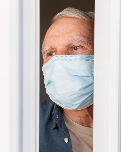 Close-up old man wearing protection mask