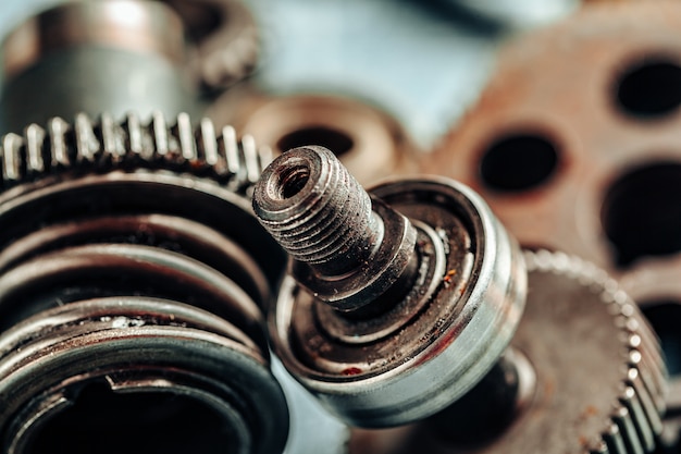 Close up of old rusty car parts on dark 