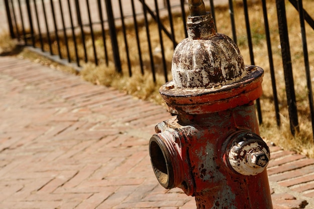 Close up of an old rusty fire hydrant on the street