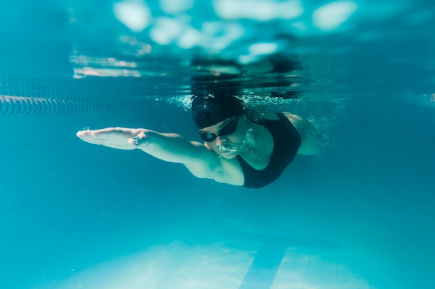 Close up of olympic swimmer underwater