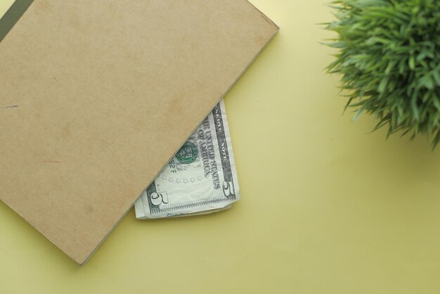 Close up of one dollar cash in a notepad