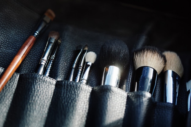 Close-up of open organizer with make-up brushes