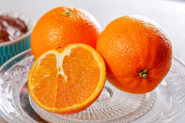 Close up of oranges in a glass dish