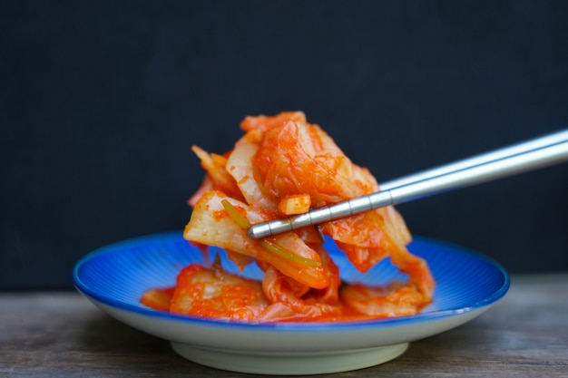 Close up of organic korean kimchi food with chopsticks