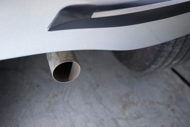 Close up of the original car exhaust pipe that is installed properly