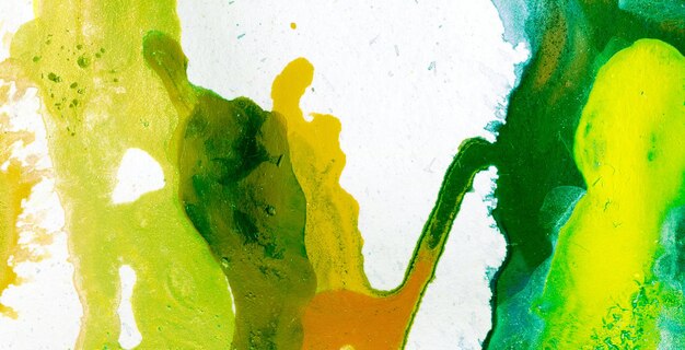 A close up of a paint with a green background