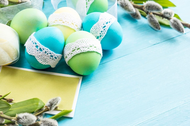 Close-up of painted easter chicken eggs on blue background