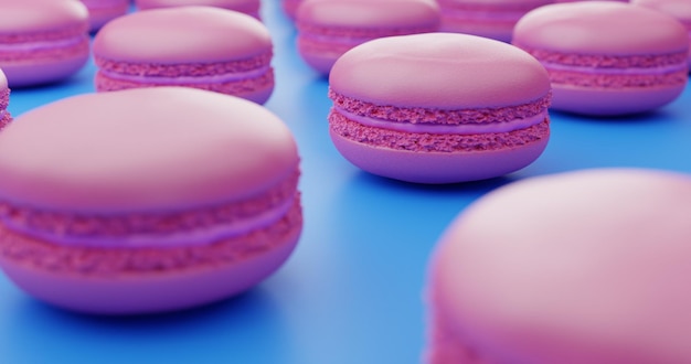 Close up of pastel pink macarons distributed in lines on blue background. Pastel colours.