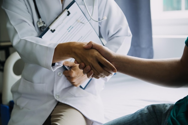 Close up of patient and doctor taking notes