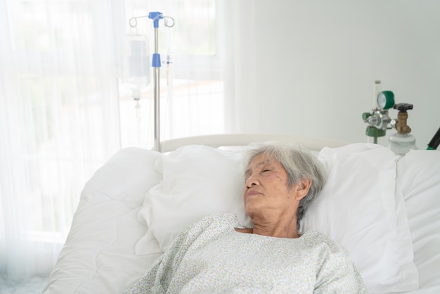 Close up of patient grandfather in hospital bed