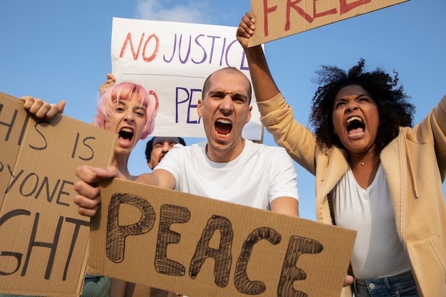 Close up people holding placards