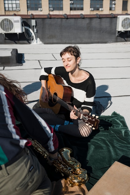 Close up people playing instruments