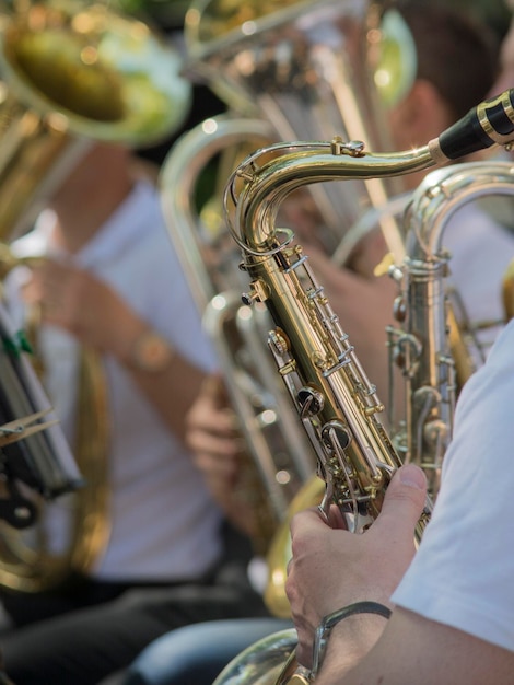 Close-up of people playing trumpet