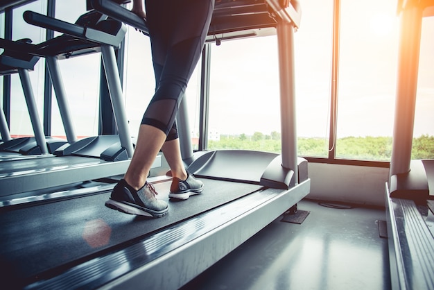 Close up of people who exercising on treadmill