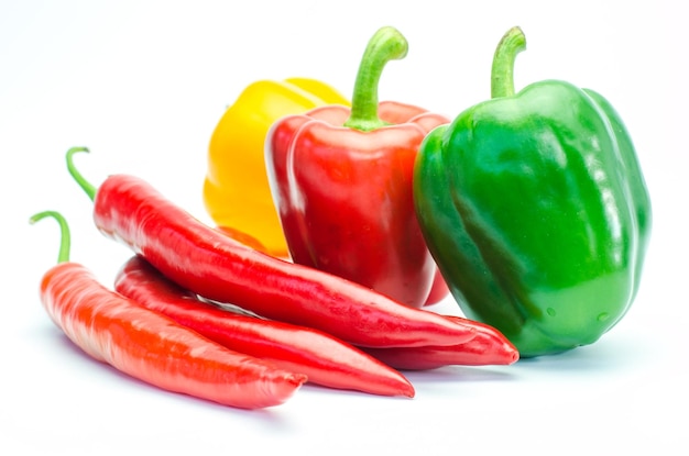 Close-up of peppers against white background