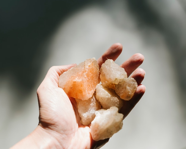 Close-up of a person's hand with himalayan salt