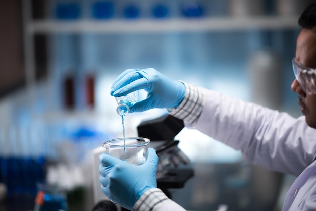 Close-up of person working in bottle