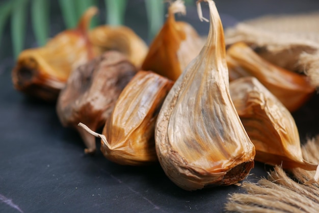 Close up pf black garlic on white background table