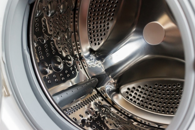 Close-up photo of empty washing machine tank.