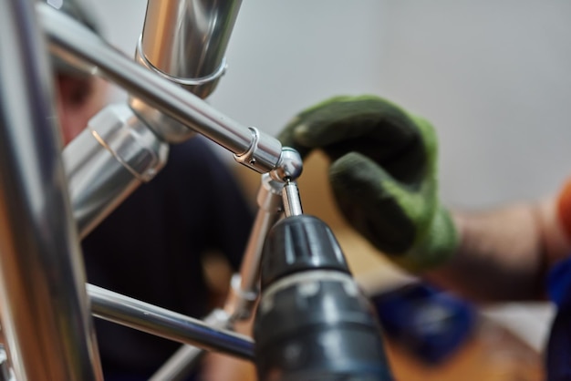 Close up photo of installation of aluminum fence Selective focus