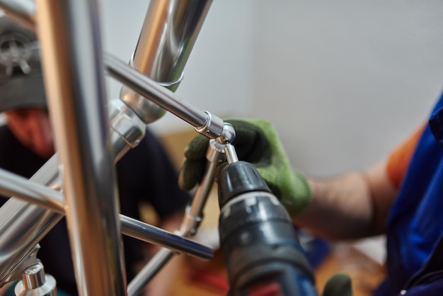 Close up photo of installation of aluminum fence Selective focus