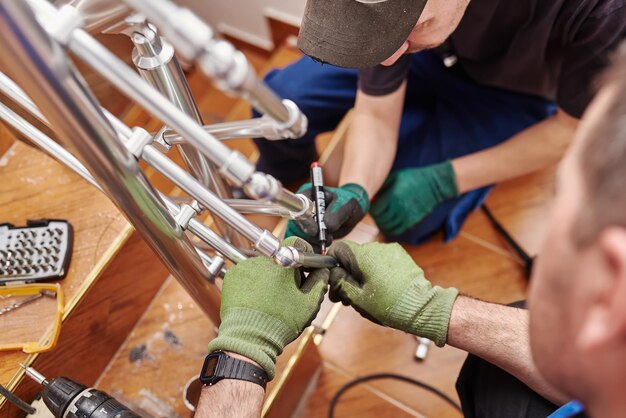 Close up photo of installation of aluminum fence Selective focus