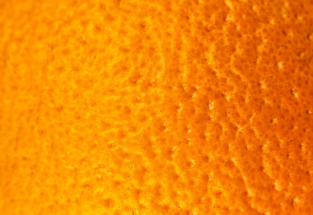 Photo close up photo of orange peel texture. oranges ripe fruit background, macro view. 
human skin problem concept, acne and cellulite.