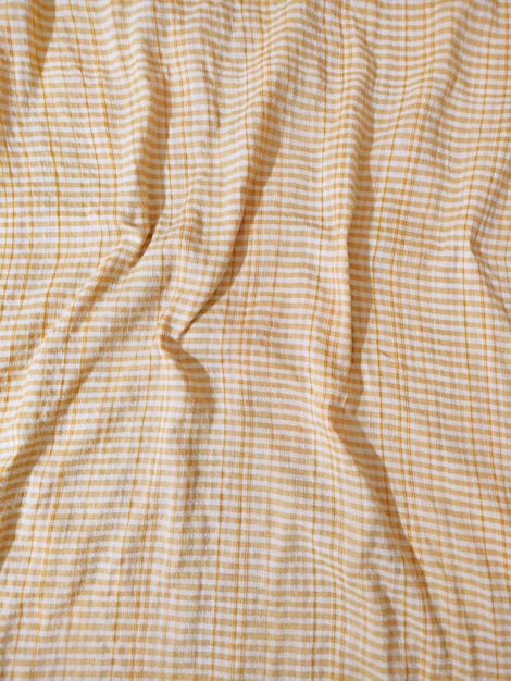 Close-up photo of yellow cotton fabric textures pattern