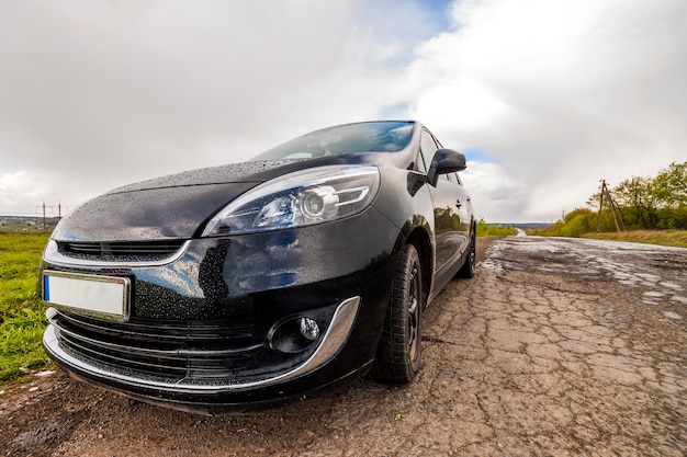 Close-up picture of a modern car on a bad road