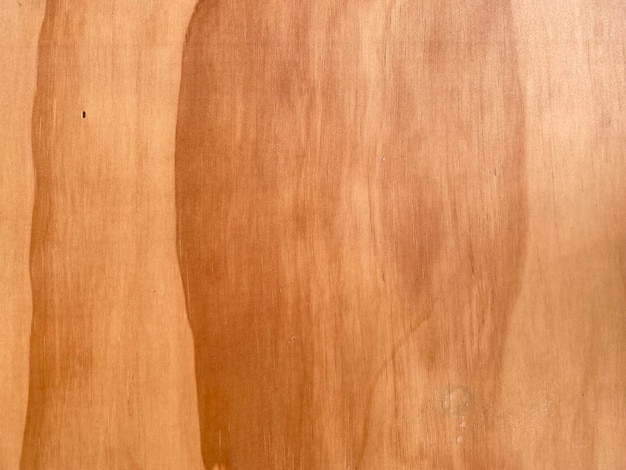 A close up of a piece of wood with a stain on it.