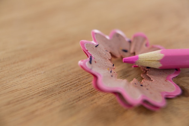 Close-up of pink color pencil with pencil shaving