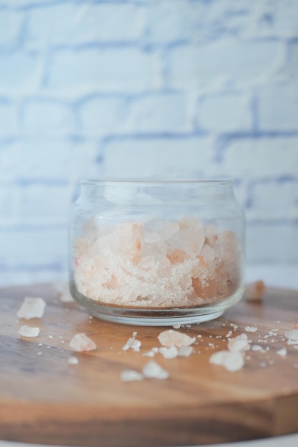 Close up of pink rock salt in a bowl on table