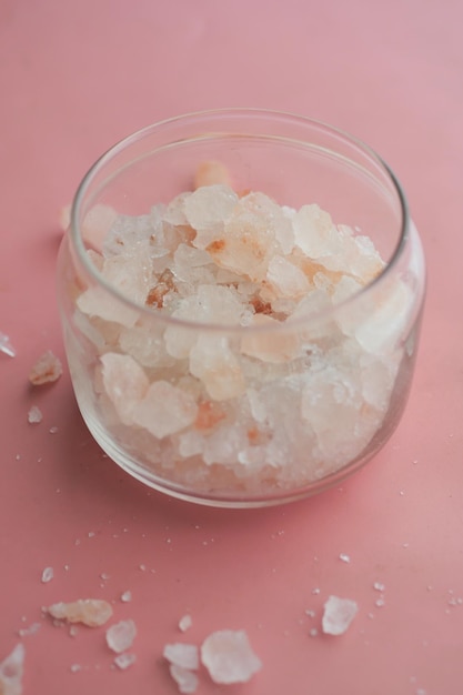 Close up of pink rock salt in a bowl on table