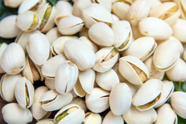 Close up of Pistachios nuts on wooden table