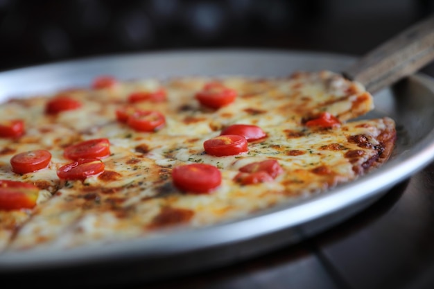 Close-up of pizza in plate on table