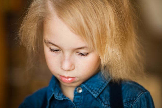 Close-up portrair of little blonde girl