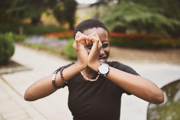 Close up portrait of attractive happy smiling young natural beauty short haired african woman