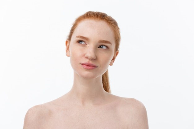 Close-up portrait of beautiful, fresh, healthy and sensual girl over white background