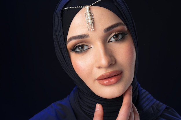 Close up portrait of beautiful muslim girl dressed in hijab