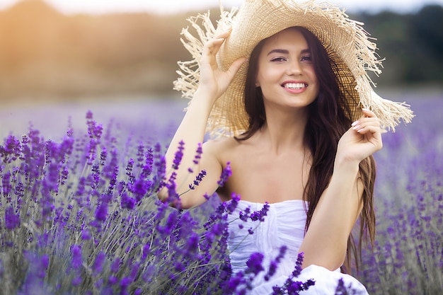 Close up portrait of beautiful young woman in lavender field.