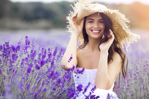 Close up portrait of beautiful young woman in lavender field.