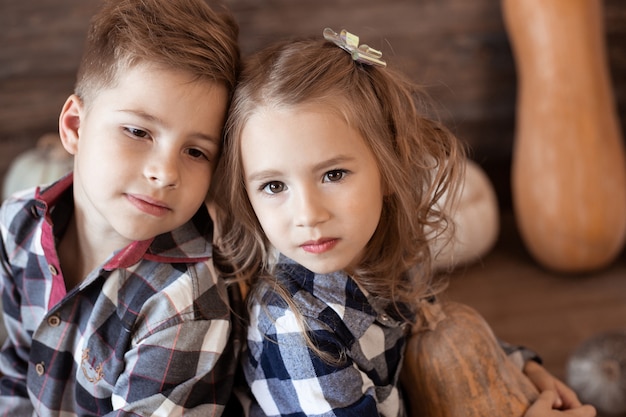 Close up portrait of boy and girl. warm autumn, children